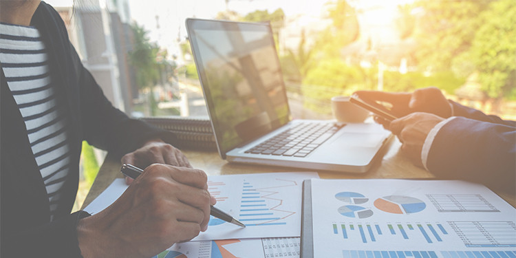 person writing on chat and person typing on a computer